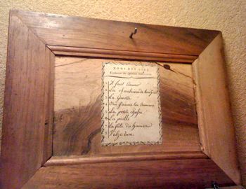 Lid of serinette, listing a Gavotte and other tunes